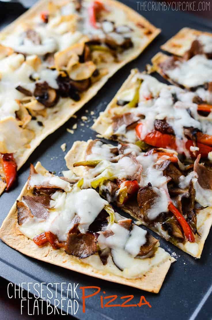 Cheesesteak Flatbread Pizza | These individually sized Cheesesteak Flatbread Pizzas are perfect for lunch or a quick easy dinner, and are a great new take on one of America's favorite sandwiches. Make them with classic beef or switch it up with chicken!