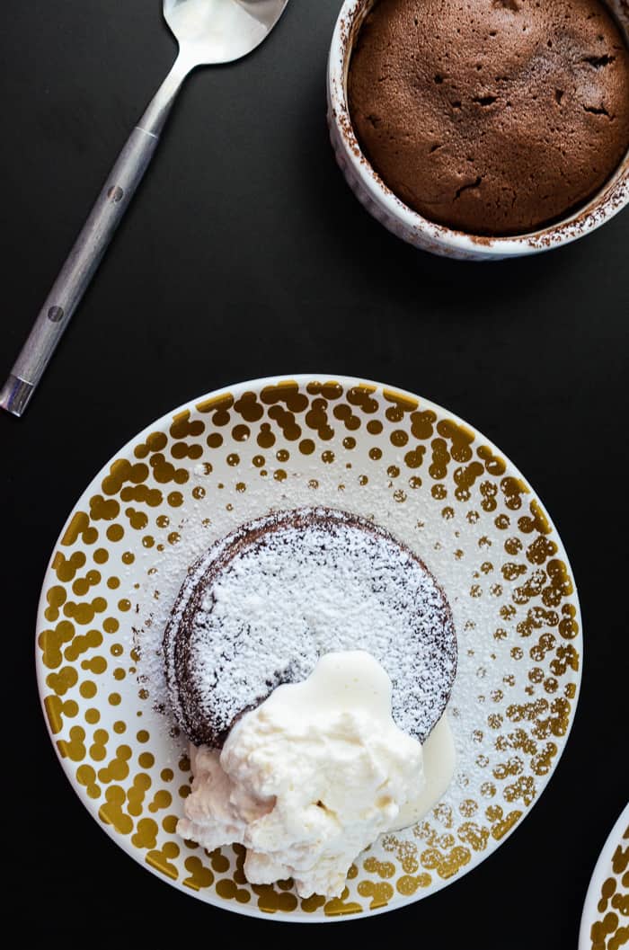 Molten Bailey's Lava Cake | A creamy twist on a chocoholic's favorite, this Molten Bailey's Lava Cake is infused and topped with Irish Creme.