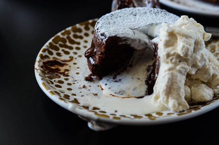 Molten Bailey's Lava Cake | A creamy twist on a chocoholic's favorite, this Molten Bailey's Lava Cake is infused and topped with Irish Creme.