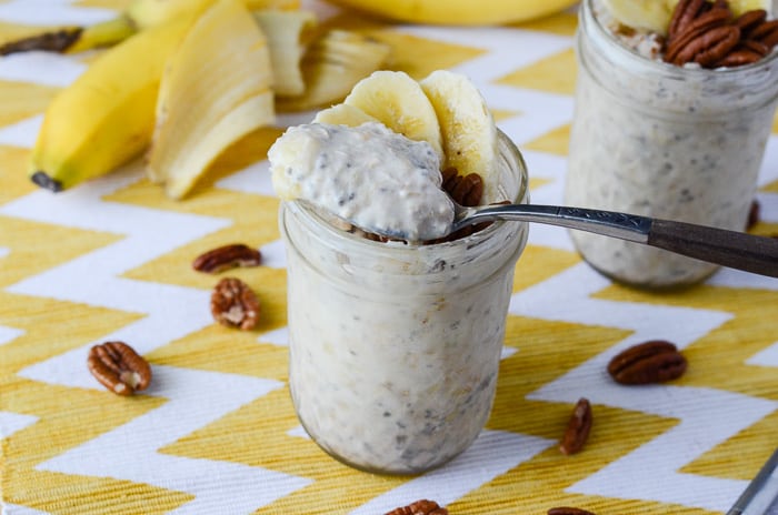 Bananas Foster Overnight Oats | Fresh bananas, a touch of rum extract, crunchy pecans, and delightful caramel yogurt make this on-the-go oatmeal breakfast good enough for dessert!