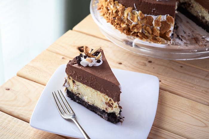 Chocolate Cannoli Cheesecake Mousse Torte | This fantastically decadent cake combines four very different desserts in to one - brownie, cheesecake, cannoli, and chocolate mousse!