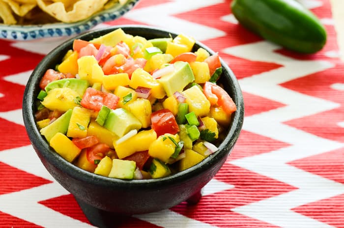Tropical Avocado Salsa | A slightly spicy, tangy, and sweet avocado salsa, playfully studded with chunks of colorful tomato, pineapple, jalapeno, and mango.