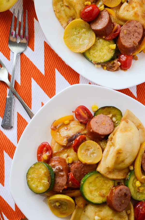 Kielbasa and Pieogies with Summer Vegetables | A summery spin on a Polish classic that's light enough to eat no matter how hot it is! Fresh summer vegetables are sautéed with kielbasa and pierogies, then tossed in a tangy Dijon vinaigrette.