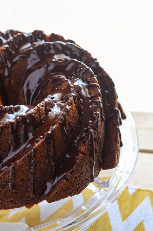 Chunky Monkey Bundt Cake | A favorite ice cream flavor, turned into an incredible bundt cake! This banana chocolate chunk walnut cake is perfect drizzled with ganache & served with a big cup of coffee!