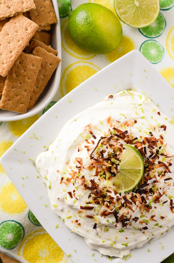 Coconut Key Lime Cheesecake Dip | A fluffy, refreshing, and versatile desert hybrid - key lime cheesecake dip combined with freshly toasted coconut is perfect for graham cracker dunkin'! 