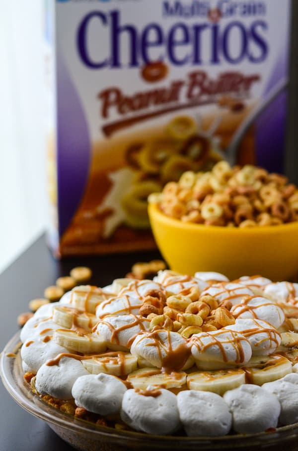 Peanut Butter Banana Cream Pie | Two flavor favorites, blended into one delightful pie filling, topped with fresh whipped cream & bananas, and nestled in a brown sugar & Cheerios crust!