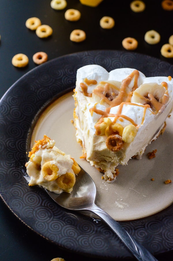 Peanut Butter Banana Cream Pie | Two flavor favorites, blended into one delightful pie filling, topped with fresh whipped cream & bananas, and nestled in a brown sugar & Cheerios crust!