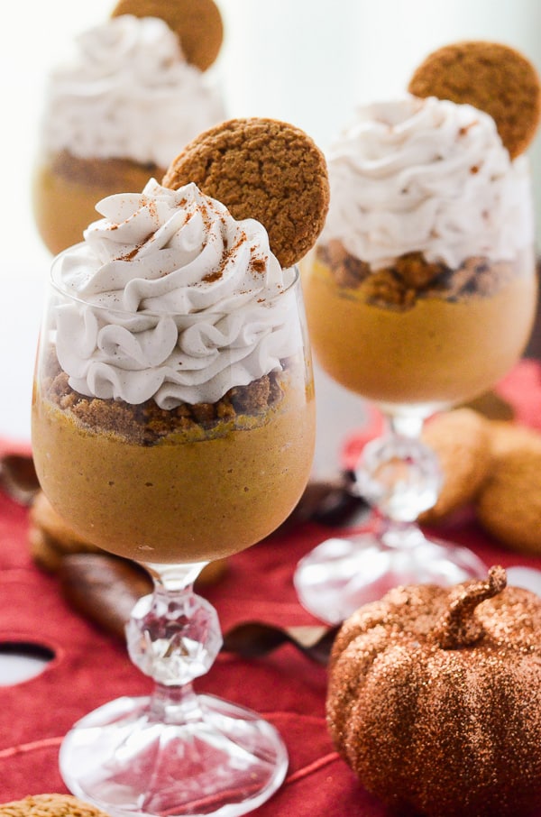 Pumpkin Pie Pots de Creme | Fall's favorite flavor, mixed up in a classic French dessert, and topped with crushed gingersnaps and a Maple Cinnamon Whipped Cream!