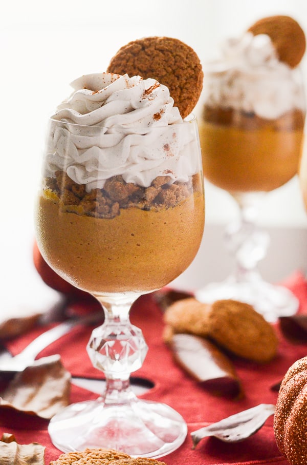 Pumpkin Pie Pots de Creme | Fall's favorite flavor, mixed up in a classic French dessert, and topped with crushed gingersnaps and a Maple Cinnamon Whipped Cream!