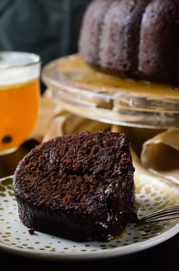 Hot Chocolate Buttered Rum Bundt | This dense chocolate cake is spiced and flavored like a mug of Hot Buttered Rum, then doused in a butter rum glaze - it's the ultimate boozy bundt! 