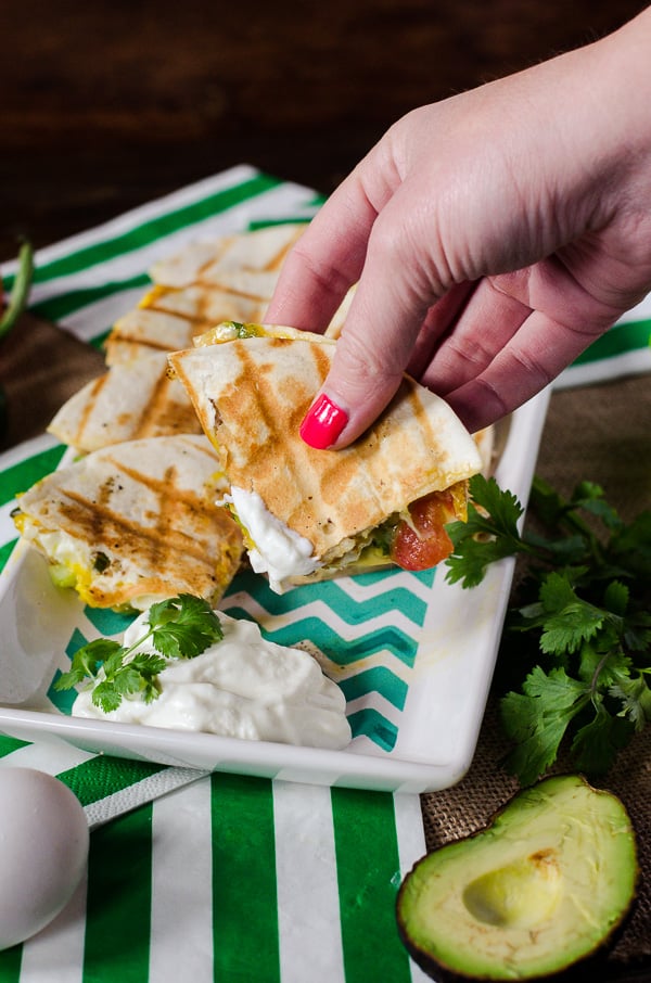 Huevos Rancheros Quesadillas | Go team avocado! This party-style take on a popular Mexican breakfast dish is loaded with green goodness, and begging to be served up for The Big Game.