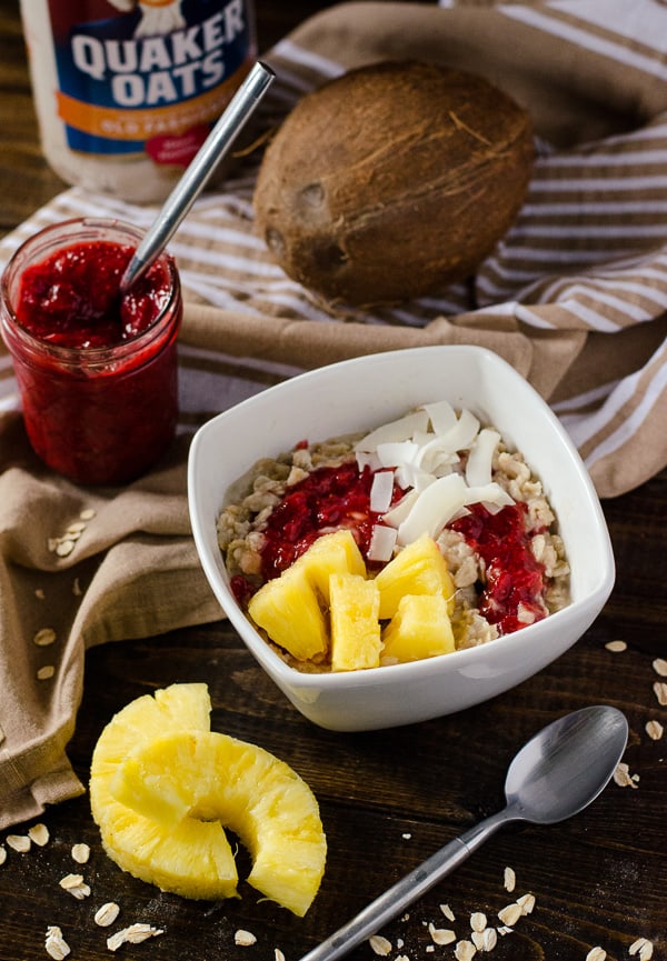 Pineapple Coconut Oatmeal with Strawberry Chia Jam | Creamy oatmeal, cooked in coconut milk and maple syrup, and swirled with homemade strawberry chia jam, fresh pineapple, and even more coconut - so good, it could be dessert!