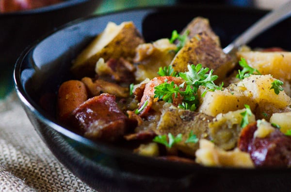 Dublin Coddle | Irish comfort food at its best! Bacon, sausage, caramelized onions, and potatoes cooked up in an apple cider-based stew - this is a delicious twist on a classic Irish stew.
