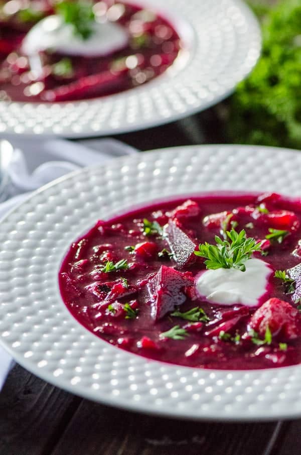 Roasted Vegetable Borscht | A traditional sweet and sour Ukrainian beet soup, enhanced with roasted vegetables, caramelized onions and leeks, all wrapped up in a brightly-colored broth - incredibly healthy and tasty to boot!