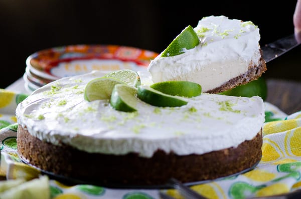 Key Lime Cream Pie | Sweet and tangy key lime filling, nestled in an almond graham cracker crust and topped with a generous helping of fresh whipped cream - the perfect Florida pie!