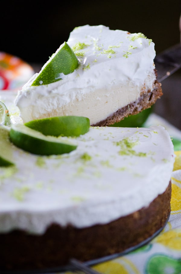 Key Lime Cream Pie | Sweet and tangy key lime filling, nestled in an almond graham cracker crust and topped with a generous helping of fresh whipped cream - the perfect Florida pie!