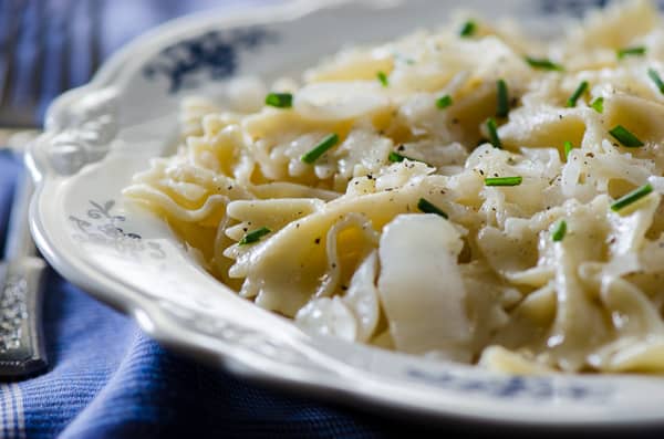 Polish Haluski | Pan fried farfalle pasta, butter-caramelized onions, and tangy sauerkraut are all you need to relax and satisfy your soul in this delicious eastern European comfort food.