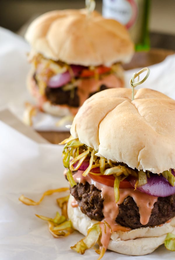 A saucy, simply seasoned burger, topped with sauteed cabbage, tomato and onion, the Chimichurri Burger is Dominican street food at its finest! 