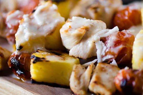 Fresh pineapple, cherry tomatoes, and coconut-marinated chicken take a classic cocktail to the grill and put it on dinner table with these Pina Colada Chicken Skewers!