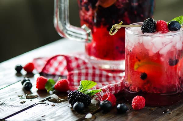 Traditional mojitos all jazzed up with fresh berries and raspberry seltzer, these quick and easy Summer Berry Pitcher Mojitos are sure to cool down a hot afternoon!