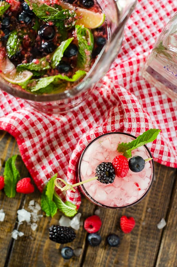 Traditional mojitos all jazzed up with fresh berries and raspberry seltzer, these quick and easy Summer Berry Pitcher Mojitos are sure to cool down a hot afternoon!