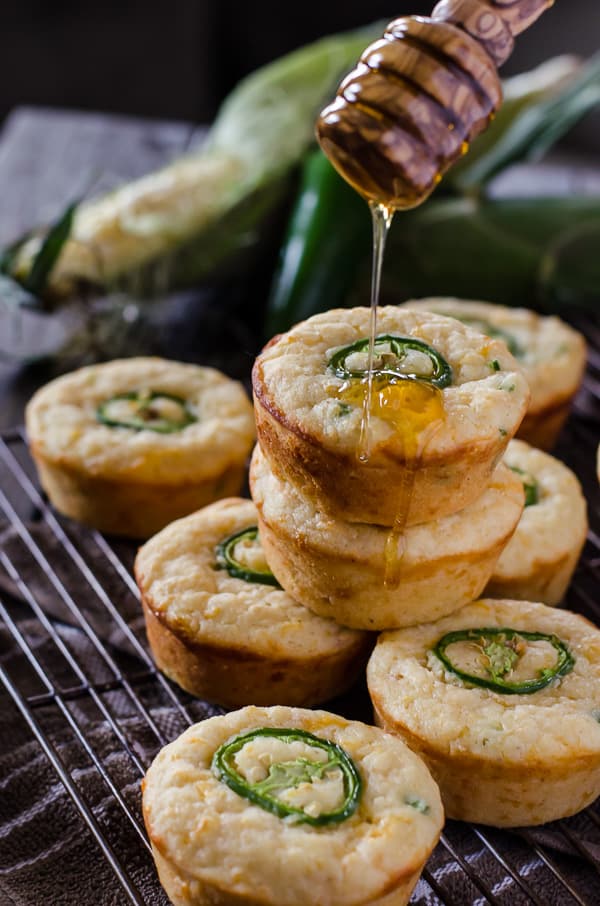 Kick up your cornbread game! These spicy, cheesy Jalapeno Popper Cornbread Muffins are the perfect side for fried chicken, chili, or just by themselves with a drizzle of honey!