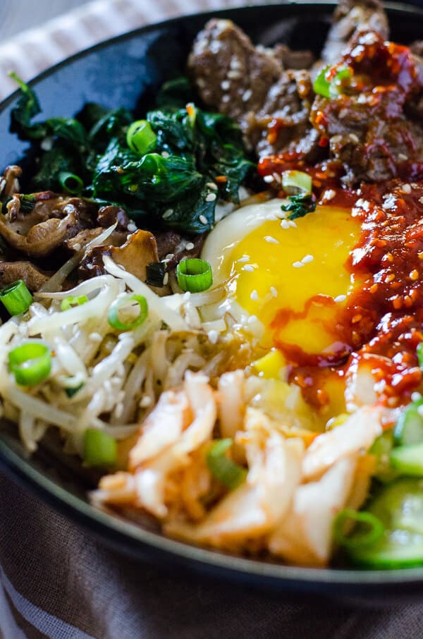 Step away from the buffet and try something different! Korean Bibimbap is an Asian food lover's dream - a bowl full crispy rice, lots of sautéed veggies, a fried egg, and some thinly sliced beef, all drizzled with a spicy sauce.
