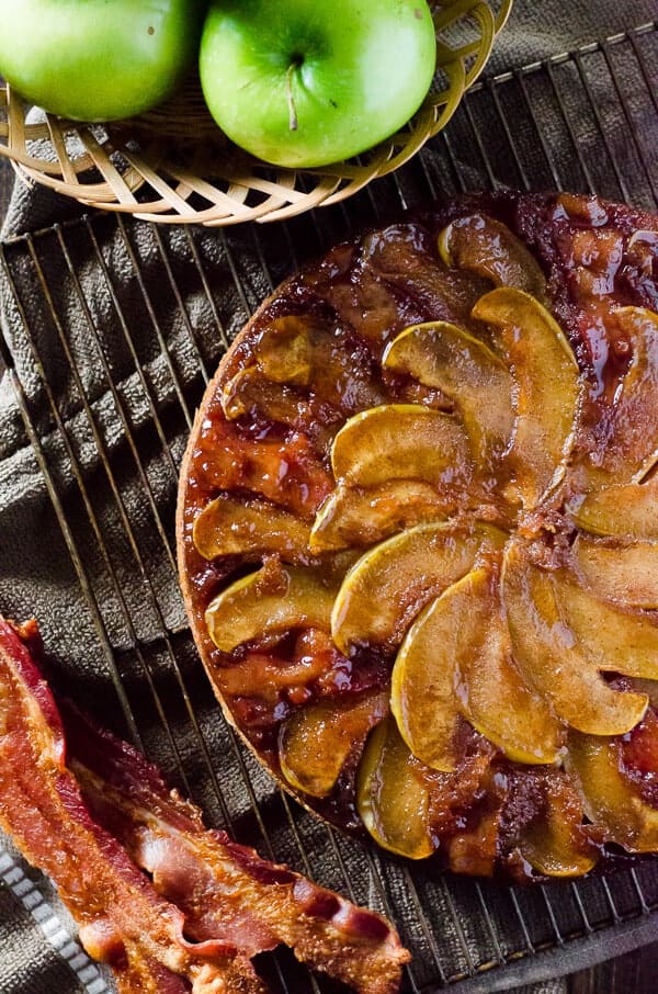 Fall flavors take center stage in this Spiced Apple Bacon Upside Down Cake! Maple-kissed apples and thick-sliced bacon top a simple bacon-infused spice cake - it's a treat perfect for any time of day!