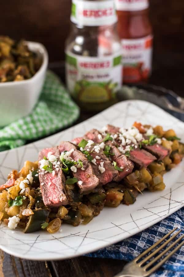 Heat up your next cookout with Spicy Grilled Steak Caponata! Classic eggplant caponata + hot peppers & salsa verde + perfectly grilled steak & crumbly cheese = a recipe for late summer salad perfection! 