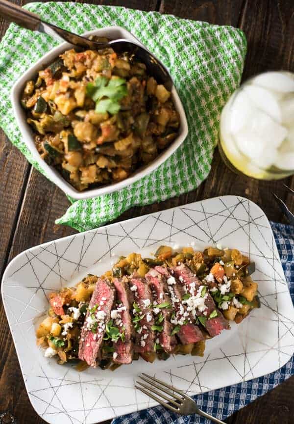 Heat up your next cookout with Spicy Grilled Steak Caponata! Classic eggplant caponata + hot peppers & salsa verde + perfectly grilled steak & crumbly cheese = a recipe for late summer salad perfection! 