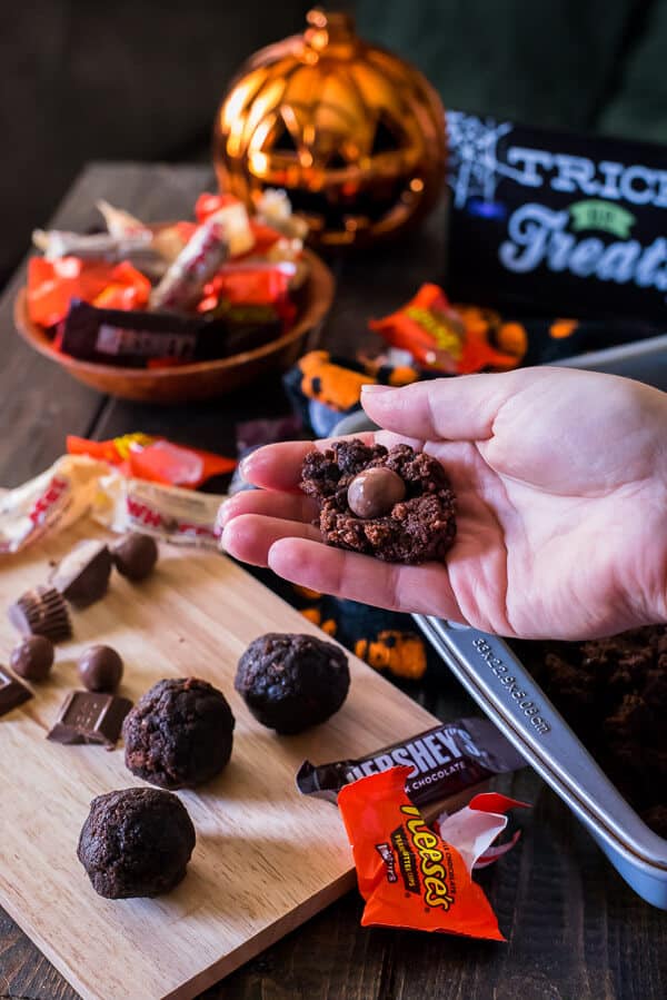 Re-purpose some of that trick-or-treat loot in a batch of these Candy Bar Truffles - chewy, fudgy brownie balls stuffed with your favorite Halloween candy and dipped in chocolate!
