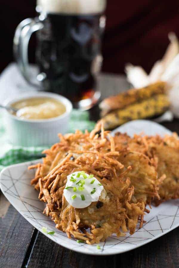 Authentic, easy to make comfort food at it's finest! These classic German Potato Pancakes, served with a side of applesauce or sour cream, are just what you need to kick off your Oktoberfest, and make a great snack any time of the day!