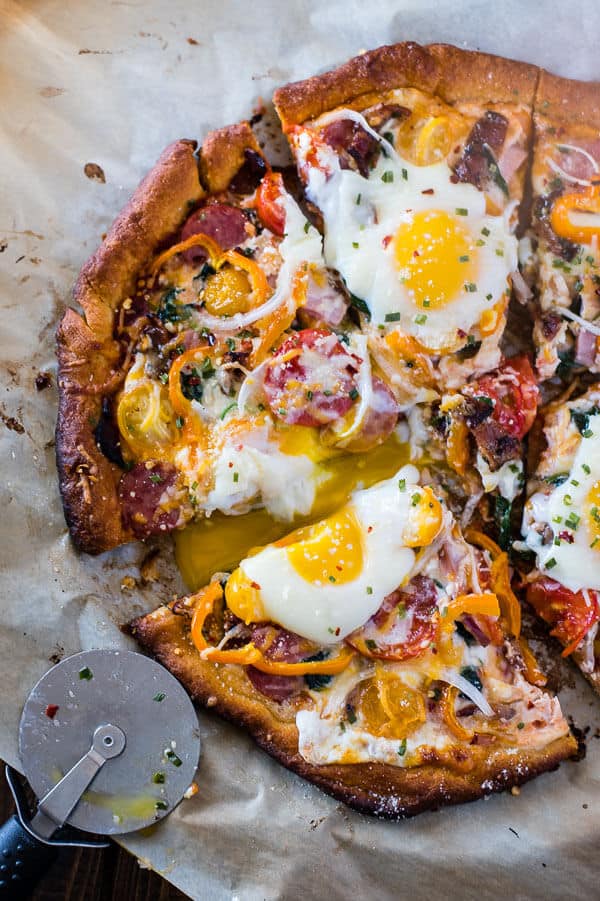Pizza for breakfast doesn't have to mean cold leftovers - this easy 30-minute Supreme Breakfast Pizza is built on a buttery crescent crust and is loaded with anything and everything your hungry morning belly can imagine!