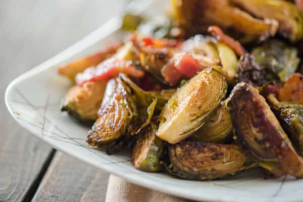 Drizzled with tangy balsamic, tossed with savory bacon, slightly sweetened with brown sugar: these simple, crispy Bacon Balsamic-Roasted Brussels Sprouts are the perfect side dish for any meal!