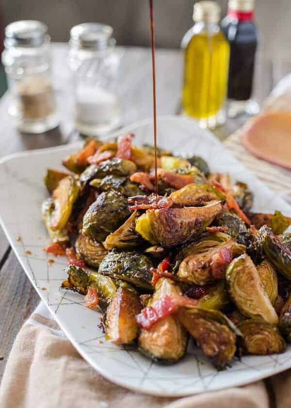Drizzled with tangy balsamic, tossed with savory bacon, slightly sweetened with brown sugar: these simple, crispy Bacon Balsamic-Roasted Brussels Sprouts are the perfect side dish for any meal!