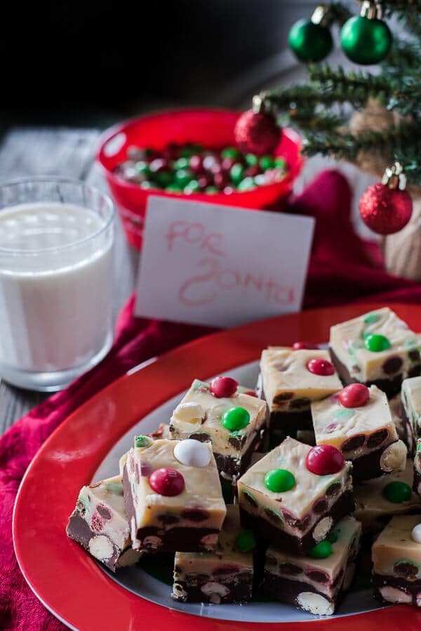 This Triple Chocolate M&M Peppermint Bark Fudge turns three holiday favorites in one! Soft, minty chocolate and white chocolate fudge studded with holiday M&M’S® is a fun treat to eat and gift!
