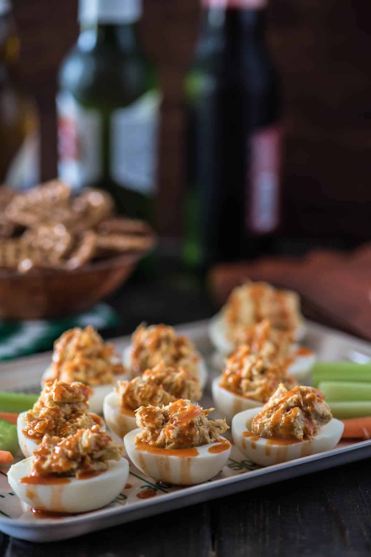 Can't decide between the chicken or the egg? Have both! These Buffalo Chicken Deviled Eggs are everything you love about big game appetizers, and so much more!