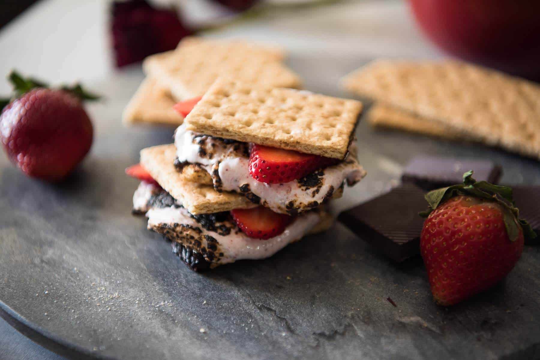 Strawberry S'mores - because winter s'mores are totally a thing! Take these classic treats up a notch by replacing the store-bought standard with homemade strawberry marshmallows, made from dehydrated Florida strawberries!
