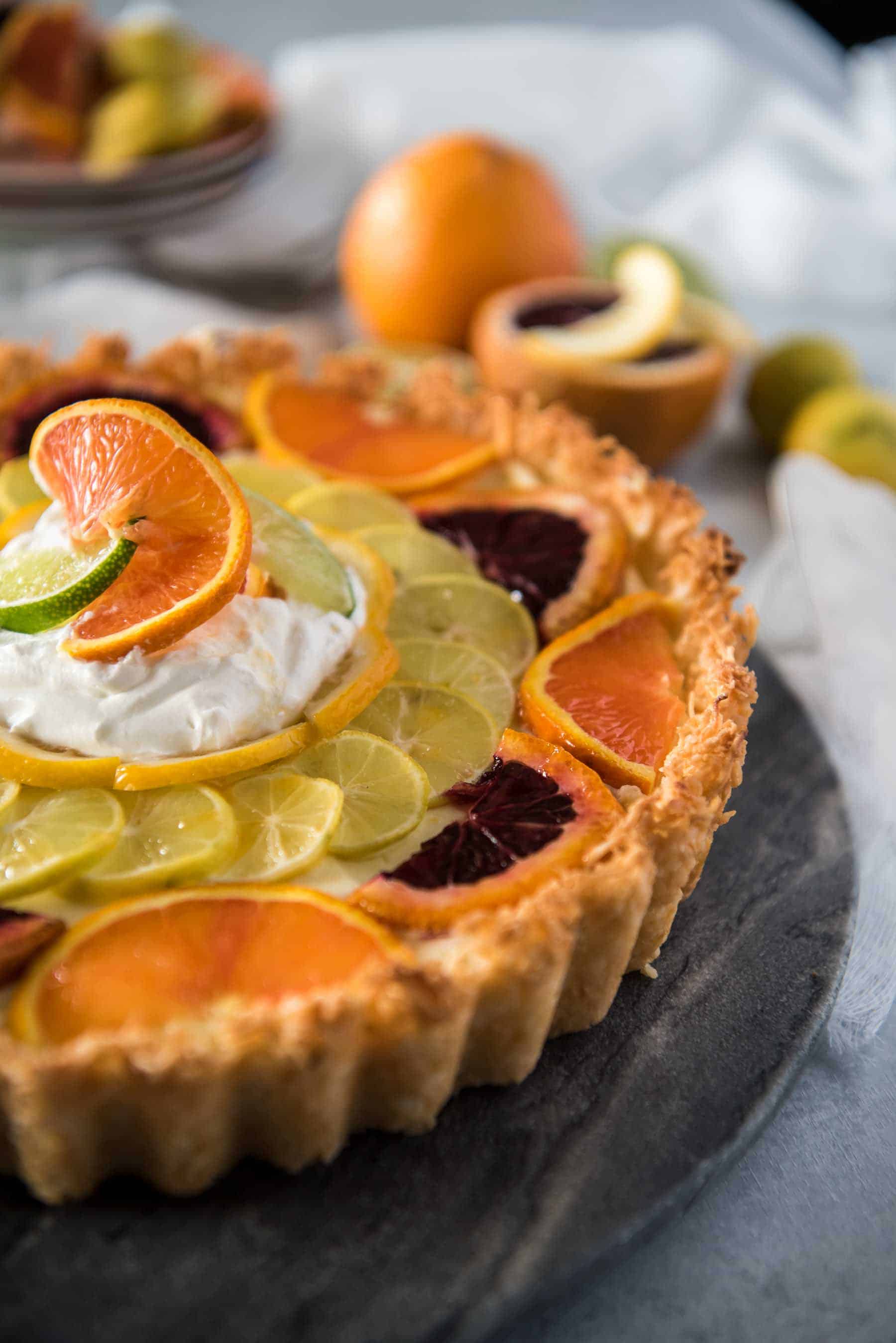 When one pie flavor just won't do - you combine three! This Triple Citrus Macaroon Mascarpone Tart is the perfect blend of sweet & tart, dense & fluffy, and is nestled in a (surprise!) coconut macaroon shell.