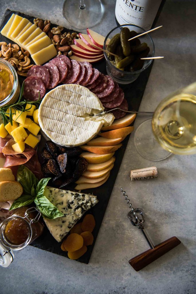 There are so many great pairs in the world of food, but cheese and wine is the best of all to a foodie! Anyone can learn how to build a cheese board, but knowing how to pair each element with your favorite wine is an art. Today, we explore the options that go beautifully with a toasty oak Chardonnay.