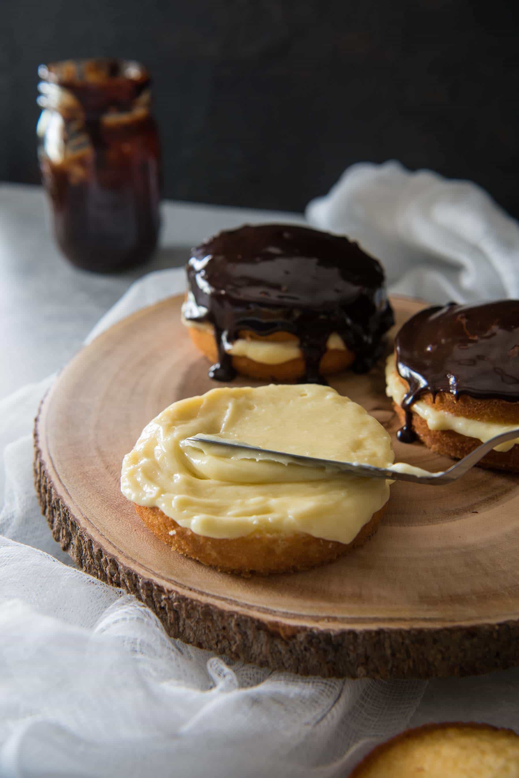 There's nothing quite like a classic Boston Cream Pie...since it's actually a cake! Rich, thick pastry cream is sandwiched between two layers of buttery yellow cake, then topped with a dark chocolate glaze.