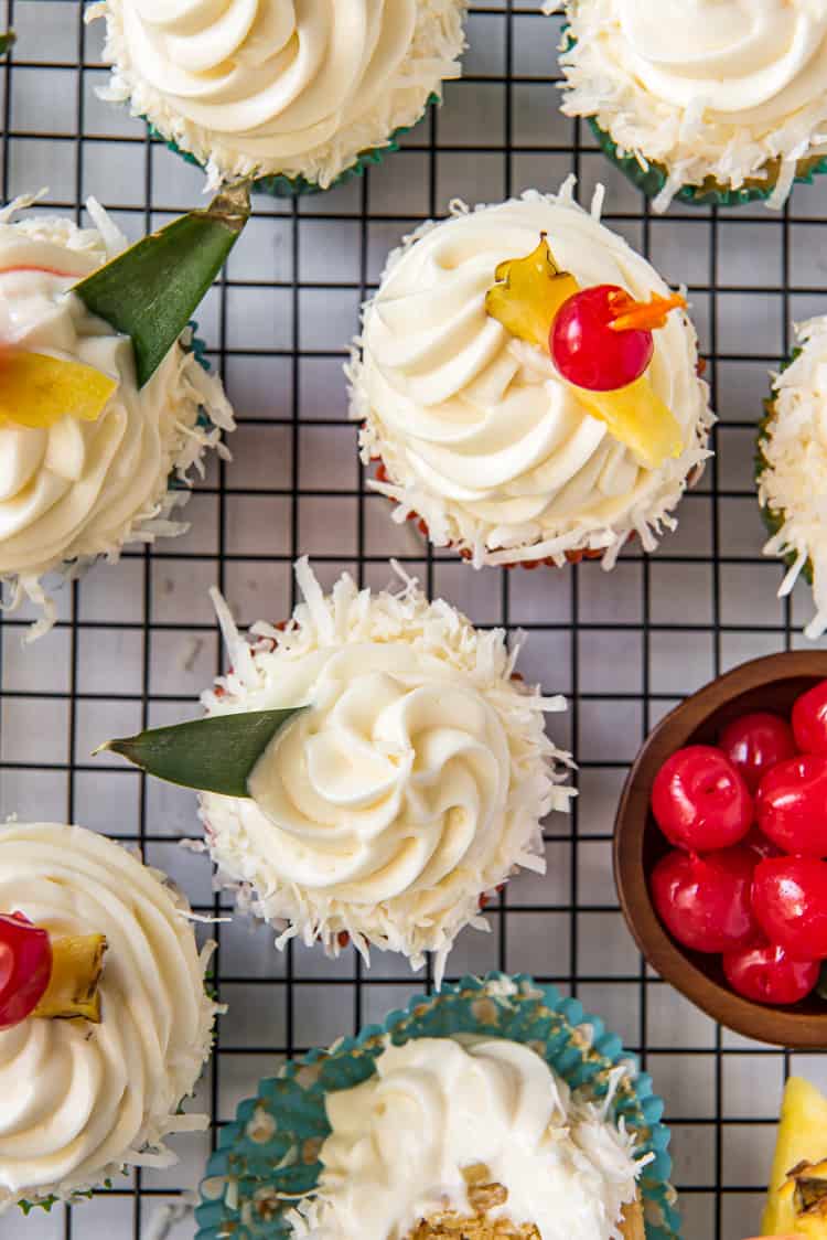 Pina Colada Cupcakes on a cooling rack