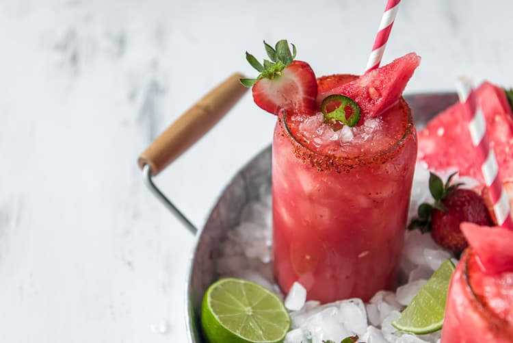 a strawberry watermelon margarita in a serving tray