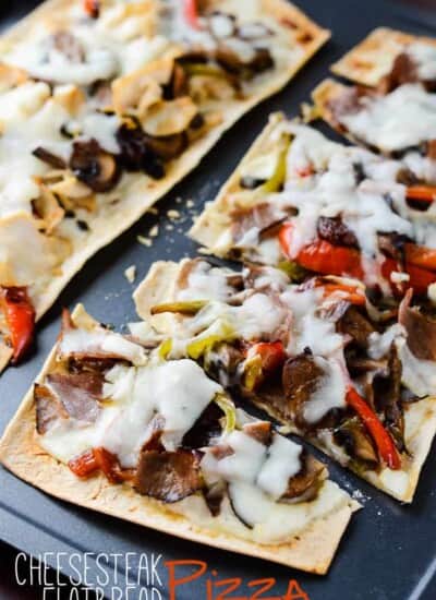 Cheesesteak Flatbread Pizza | These individually sized Cheesesteak Flatbread Pizzas are perfect for lunch or a quick easy dinner, and are a great new take on one of America's favorite sandwiches. Make it with classic beef or switch it up with chicken!