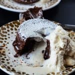 Molten Bailey's Lava Cake | A creamy twist on a chocoholic's favorite, this Bailey's Molten Lava Cake is infused and topped with Irish Creme.
