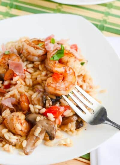 Mushroom Caprese Risotto with Balsamic Shrimp | A traditional side dish is the star of the dinner table in this simple meal, bringing together the classic flavors of caprese, prosciutto, and shrimp in a creamy, white wine risotto.