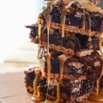Caramel S'mores Brownies | Amazingly easy gooey s'mores brownies, stuffed with caramel, chocolate chunks & marshmallow, set on a graham cracker crust & drizzled with more caramel.