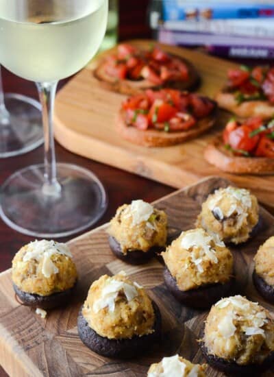 Crabcake Stuffed Mushrooms | A perfect snack for any dinner, party, or a fancy Girl's Night In, these apps combine the simplicity of crabcakes with the fun of stuffed mushrooms.