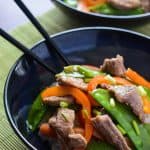 Peachy Sweet and Sour Pork Stir Fry | A delicious stir fry dinner you can have on the table in 30 minutes, doused in a tangy peach sweet & sour sauce!