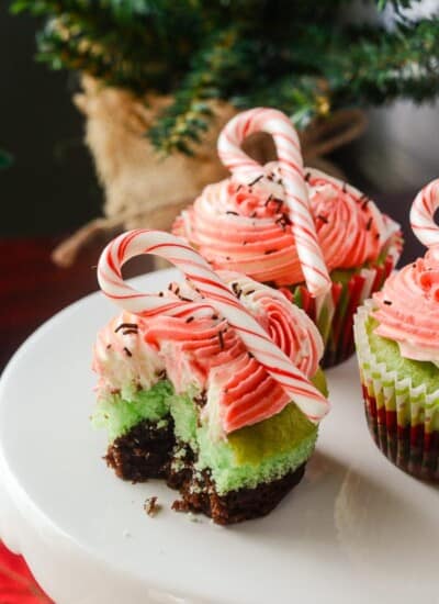 Mint Brownie Cupcakes | Two worlds collide in this quick and simple double-decker cupcake recipe - a layer of cake and brownie is topped off with a festive vanilla bean buttercream.